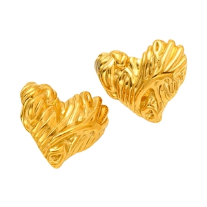 Polished gold heart studs with vintage textured surface and minimalist metal design