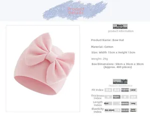 Detailed view of pink cotton baby beanie with bow showing dimensions 15x13cm and soft fabric