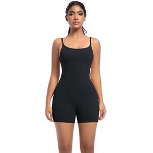 Detailed front view of women's black slim fit yoga jumpsuit with thin spaghetti straps
