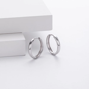 Detailed view of S925 sterling silver hoop earrings with polished finish and hallmark