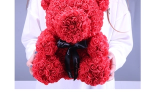 Detail of red rose bear made of PE flowers with Just For You ribbon held by a model