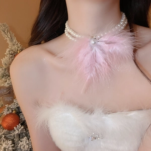 Close-up of elegant double-layer pearl necklace with pink feather bow on model