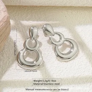 Polished silver stainless steel drop earrings with three geometric tiered rings