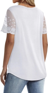 Detail of white women's top featuring elegant lace embroidery sleeves and back cut design