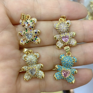 Detail of teddy bear pendants with heart-shaped gems and micro-pave zircon crystals