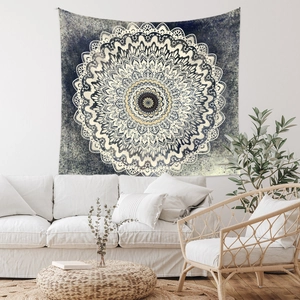 Detailed Bohemian mandala wall hanging tapestry over a white sofa in a cozy living room