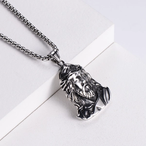 Punk style stainless steel Jesus portrait pendant with relief texture on white pedestal