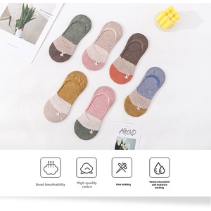 Detailed view of six pairs of low-cut cotton socks with white rabbit embroidery details