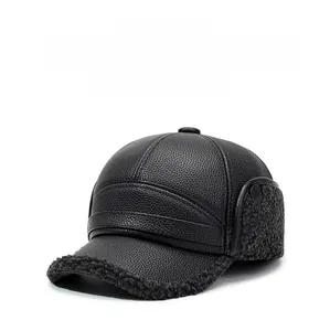 Detail of winter faux leather baseball cap with grey lamb wool lining and ear flaps
