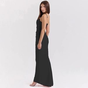 Side view of a backless black maxi dress with elegant ruching and floor-length hemline