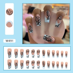 Long ballerina press-on nails with light blue french tips and black butterfly patterns