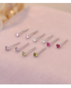 Macro view of S925 sterling silver stud earrings with colorful zircon gemstones