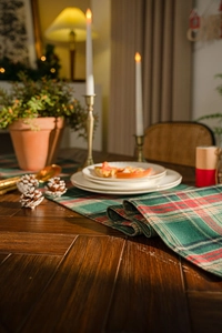 Detailed close-up of Christmas red and green plaid table runner in cotton linen fabric