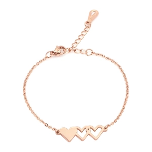 Detailed macro view of rose gold triple heart link bracelet with 18KGP engraving