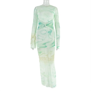 Detail of light green mesh dress with marble print and waist knot design on ghost mannequin