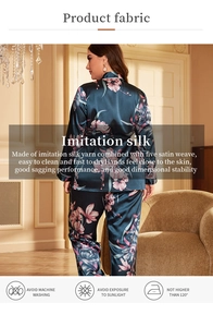 Detail of navy silk-like robe with purple floral patterns and elegant satin texture