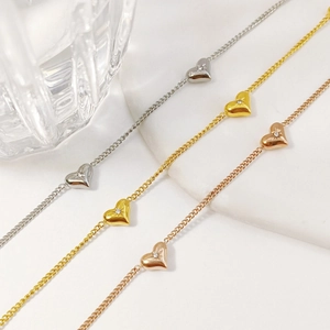 Minimalist heart chain bracelets in gold, silver, and rose gold with zircon accents