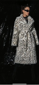 Close-up of leopard print faux fur coat featuring a wide lapel and thick texture