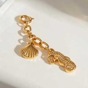 Connettore bikini in acciaio inossidabile dorato con ciondoli a forma di cavalluccio e conchiglia