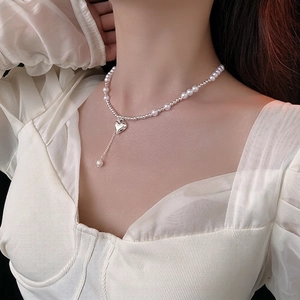 Elegant silver heart pearl necklace featuring beaded chain and drop pearl pendant