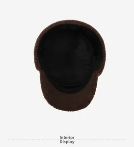 Detail of warm brown fleece hat showing the thick black plush lining and interior texture