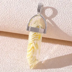 Macro shot of a resin crystal pendant featuring an artificial lemon slice and silver clasp