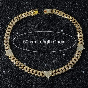 Macro view of 50cm gold Cuban link necklace with iced-out heart pendants and box clasp
