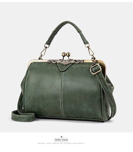 Detailed side view of dark green retro doctor bag with vintage bronze metal frame