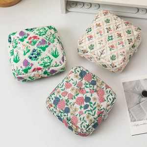 Three-piece set of floral quilted makeup bags with secure zipper and soft fabric