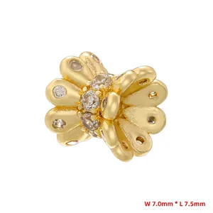 Detailed macro view of 18K gold plated flower spacer bead with sparkling zircon stones