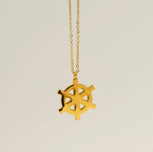 Close-up of golden 18K vacuum plated stainless steel compass pendant necklace
