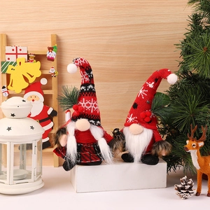 Pair of Christmas gnome plush dolls with red knitted hats and festive plaid outfits