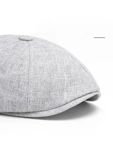 Macro detail of grey linen ivy cap featuring a wide adjustable brim for face shaping
