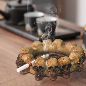 Gothic skull ashtray with vintage relief design for home decor and Halloween settings