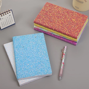 Sparkly glitter sequins notebook journals in various colors with 2024 calendar office setup