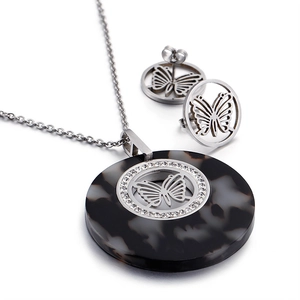 Silver butterfly jewelry set featuring marble texture pendant and rhinestone earrings