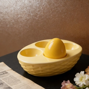 Yellow ceramic 4-slot woven basket egg holder with decorative egg for Easter storage