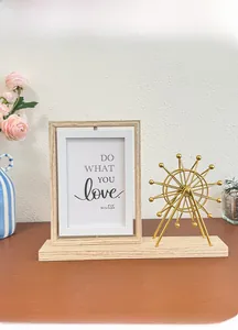 Close-up of a 6-inch spinning wooden photo frame with a golden Ferris wheel desk ornament