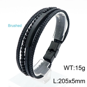 Macro shot of multi-layer men's black leather bracelet with beaded details and metal clasp