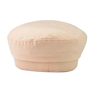 Detail view of beige cotton twill octagonal newsboy hat with stitched retro texture