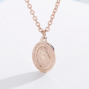 Detail of 18k rose gold plated Miraculous Medal pendant on an O-chain necklace