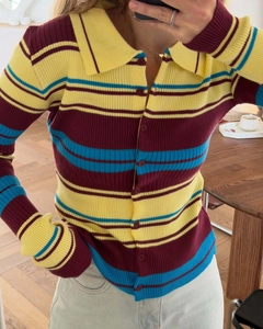 Detail of slim-fit retro striped knit cardigan with Polo collar and colorful rib texture