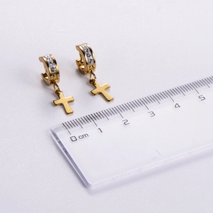 Golden cross hoop earrings with white rhinestones and a scale reference for size