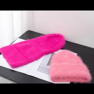 Fuzzy pink and rose red thick winter beanies made of soft plush mohair-style yarn