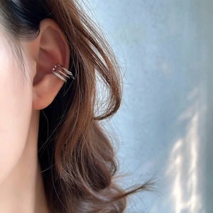 Three-layer S925 sterling silver ear cuff with braided texture and zircon inlay on model