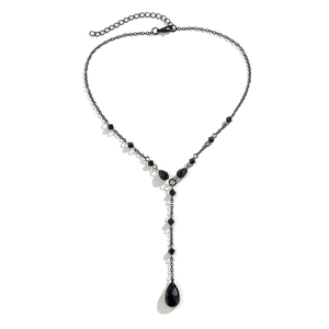 Macro detail of gothic black Y-necklace featuring faceted beads and waterdrop pendant