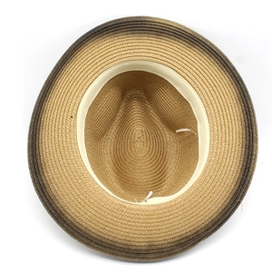 Macro detail of hand-woven straw hat interior with sweatband and gradient brim