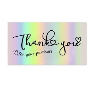 Detail of holographic rainbow thank you card with cursive text for gift packaging