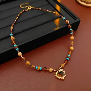 Bohemian heart stone pendant necklace with colorful beads on a premium display