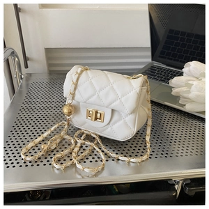 Detailed view of the gold twist lock and quilted leather texture on the white mini bag